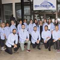 <p>Dr. David Jacobsen, far left, is shown with the entire staff of B.R.i.D.G.E.S. (formerly Rockland Independent Living Center) at the Roll It Out event in Nanuet on Oct. 22.</p>