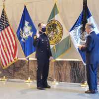 <p>Greenwich Police Chief James Heavey promotes Det. Daniel Bucci to the rank of sergeant.</p>