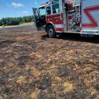 <p>Crews on the scene of the grass fire at Pye Brook Park in Topsfield</p>