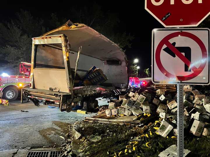 The overturned box truck