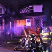 <p>Firefighters went to an exterior attack during the multi-home fire on 2nd Street in Clifton.</p>