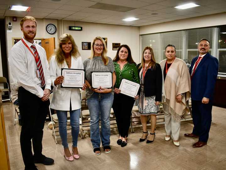 Three Connetquot School District staff members were honored at a recent Board of Education meeting after they saved the lives of children who were choking.