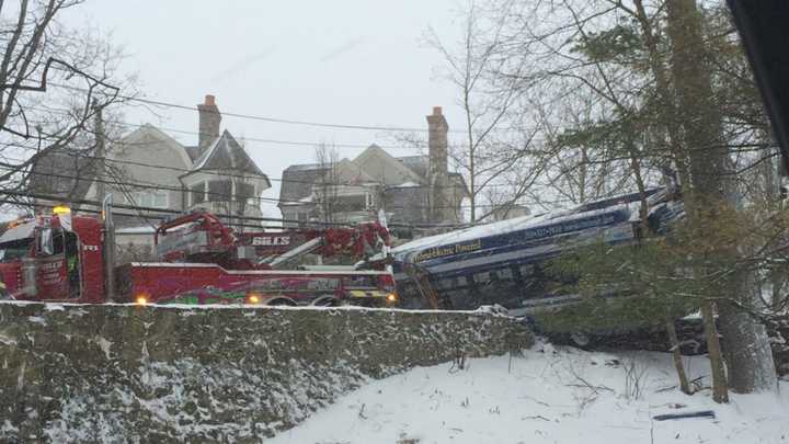 A heavy duty wrecker pulls out the crashed CTTransit bus in Greenwich.