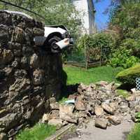 <p>A stone wall was damaged in the Saturday crash.</p>