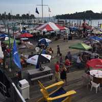 <p>Captain&#x27;s Cove Seaport, located on historic Black Rock Harbor in Bridgeport, has a large outdoor deck ideal for summer dining.</p>