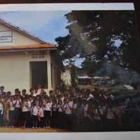 <p>Students stand outside the Zahn School in Cambodia.</p>