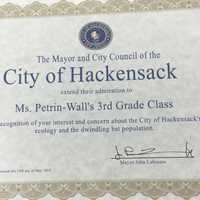 <p>The mayor presented a certificate of admiration to Ms. Petrin-Wall's third grade class</p>