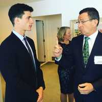 <p>Gov. Dannel Malloy talks with President John Kennedy&#x27;s grandson, Jack Schlossberg, on Sunday at the JFK Library. Schlossberg presented Malloy with the Profile in Courage award in Boston.</p>