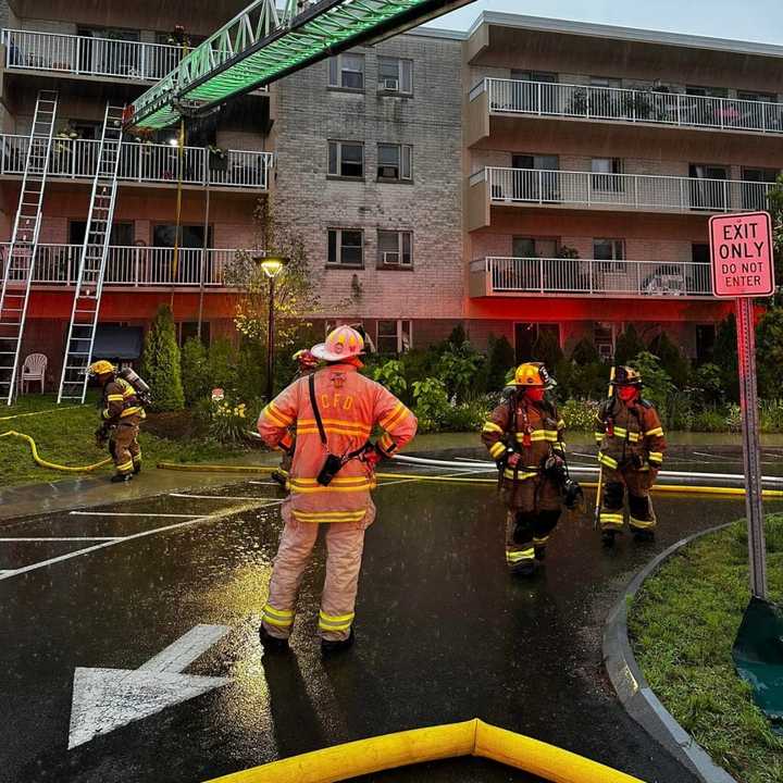 Chicopee firefighters used a 35-foot ladder to rescue a man and his dog from a third-story balcony on Sunday morning, July 2.