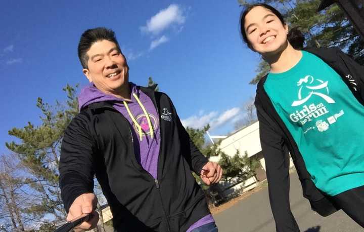 Chin runs with daughter Mika.