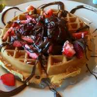 <p>Waffles drizzled with Nutella, a hazelnut-cocoa spread, and topped with strawberries, at Chip&#x27;s Family Restaurant in Fairfield,</p>