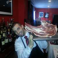 <p>Eat your heart out, Fred Flintstone! A caveman size portion of tomahawk steak, aka ribeye loin, is destined for some lucky diner&#x27;s plate at The Chophouse Grille in Mahopac.</p>
