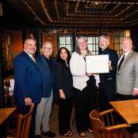 <p>Danbury Mayor Dean Esposito presents the restaurant with a proclamation celebrating 50 years in business.</p>