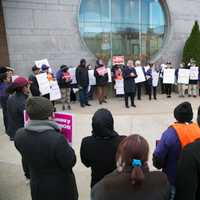 <p>Supporters rally in a circle around State Sen. Carlo Leone (D-Stamford) as he speaks at a rally for immigrant rights outside the courthouse in Stamford.</p>