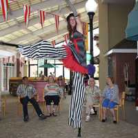 <p>Circus acts included a professional stilt walker and hula hoop performer.</p>