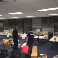 <p>Members of the Clarkstown Police Department Explorers program prepare to wrap the many gifts donated for local families.</p>