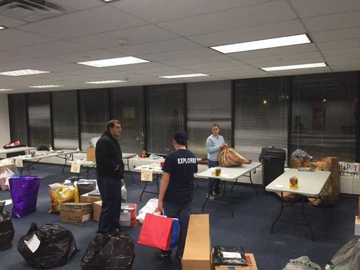 Members of the Clarkstown Police Department Explorers program prepare to wrap the many gifts donated for local families.