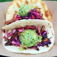 <p>Candied Apple Roast Pork Tacos with Guac are a favorite at the many street fairs they attend.</p>