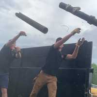 <p>Co-founder Kirk and a team member remove trash</p>