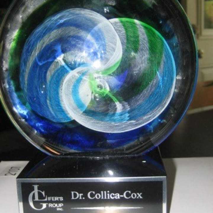 Dr. Kim Collica-Cox received a recognition award from the Lifer&#x27;s Group, a New Jersey prison-based hip hop group.