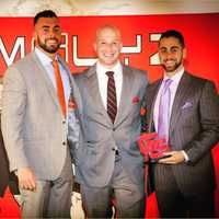 <p>Sam Langer, right, and Jimmy Bonavita, right, meet with GYMGUYZ CEO Josh York at a conference earlier tis year.</p>