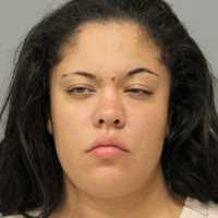 Westbury Woman Stabs Man In Front Of 3-Year-Old Girl In Roosevelt, Police Say