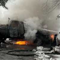 <p>A firefighter working to extinguish the fire.</p>