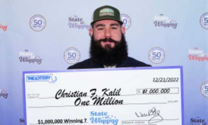 Christian Kalil with his check for $1 million.