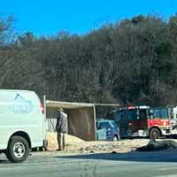 <p>The tractor trailer was filled with sand and leaking fuel.</p>