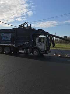 Garbage Truck Crashes Into Utility Pole In Area