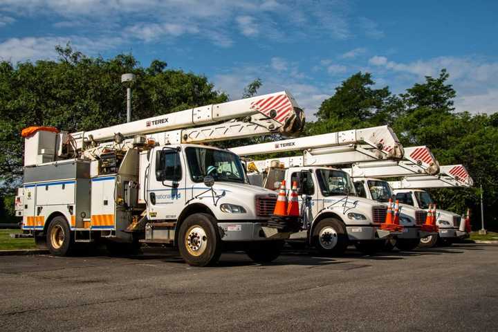 A crew of utility trucks gets ready to head for home following the massive restoration on Long Island.