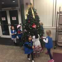 <p>A Saddle Brook Daisy troop spread holiday cheer at the Kessler Rehabilitation Center.</p>