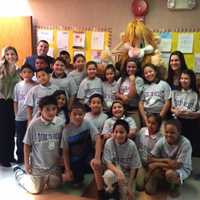 <p>Students from Elmwood Elementary School in Monsey celebrate graduating from the Ramapo Police Department&#x27;s D.A.R.E. program with Ramapo Police Officer Danny Lynch, rear left, and mascot, Daren the D.A.R.E. Lion.</p>