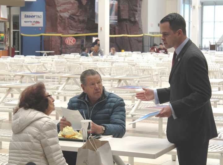 Senator Carlucci greets shoppers at the Palisades Mall and gives them information about new gift card laws