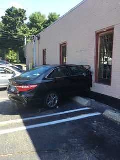 Flying Bricks: Car Slams Into Salon In Milford