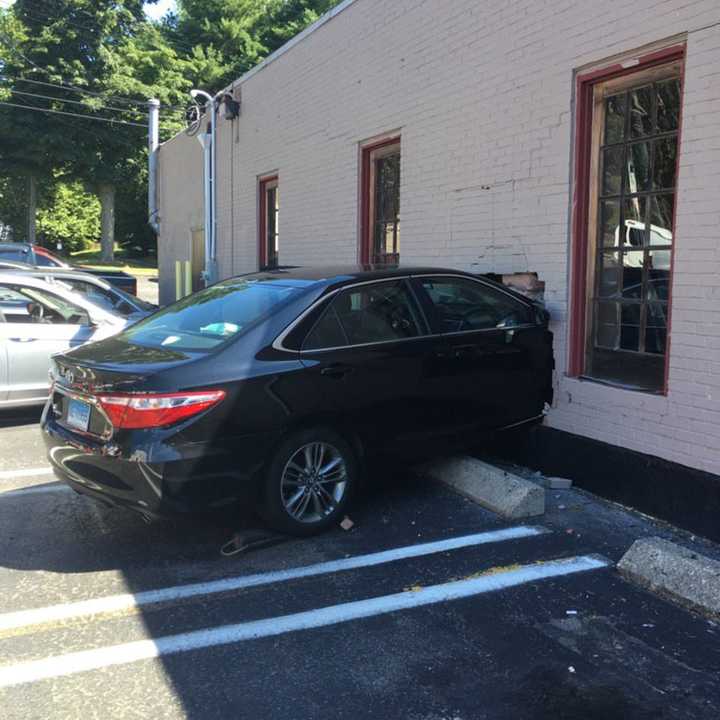 A car slammed right through the brick wall at Styles Salon at 940 Boston Post Road in Milford.