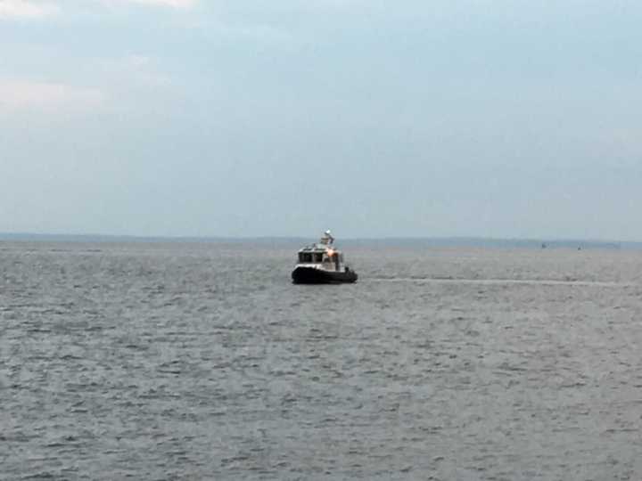 A boat searches the water of Long Island Sound off the coast of Stratford on a report of a possible missing person. The search turned up empty and was believed to be a false alarm.