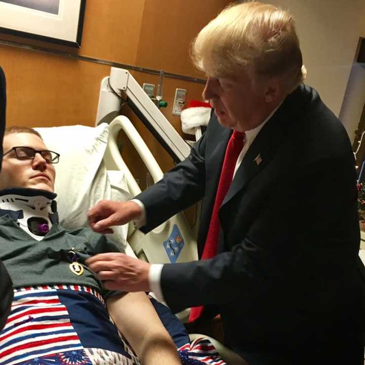 President Donald Trump awards Victor Prato a Purple Heart.