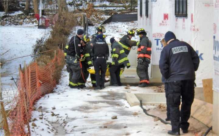 Firefighters rescued the worker through a window well.