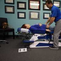 <p>Dylan DeLorenzo works on a patient at Applied Kinesiology Center of New Jersey in Paramus.</p>
