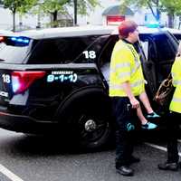 <p>Responders tended to the shaken but not physically injured motorist following the Aug. 15 crash in Paramus.</p>