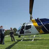 <p>New Jersey State Police Trooper Evan Curtiss (at right), a Ridgewood High School graduate and former village Emergency Services member, piloted the chopper.</p>