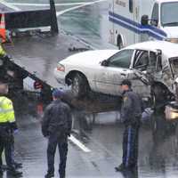 <p>A flatbed tow truck removed the 4-door sedan.</p>