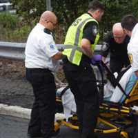 <p>The woman, who was alert after being carried from the car, smiled as she thanked her rescuers.</p>