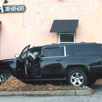 <p>The Chevy Suburban livery vehicle careened into a nail salon and rollover trash bin on northbound Route 17 in Paramus.</p>