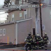 <p>The two-alarm fire ignited on the exterior of the Godwin Avenue building that houses Custom Cut Salon before flames made their way inside.</p>