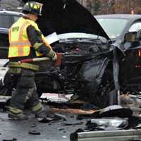 PHOTOS: Two Hospitalized, RR Sign Smashed In Midland Park Crash