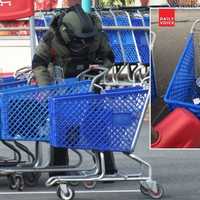 <p>Bergen County Sheriff&#x27;s Bomb Squad member at Glen Rock shopping complex.</p>