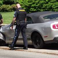 <p>The impact pushed the Mustang onto the sidewalk.</p>