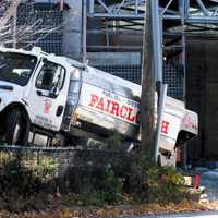 <p>The truck barreled through a fence, clipped a pole and stopped short of the River Drive house in Elmwood Park.</p>